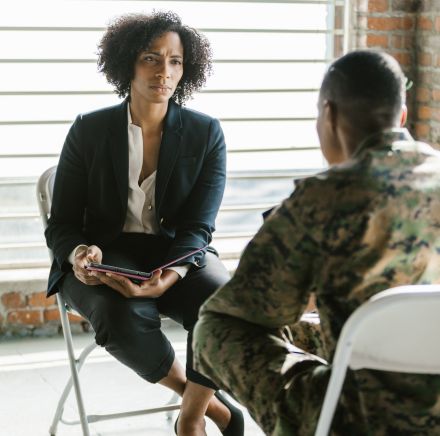 Photo of Psychologist Listening to a Soldier